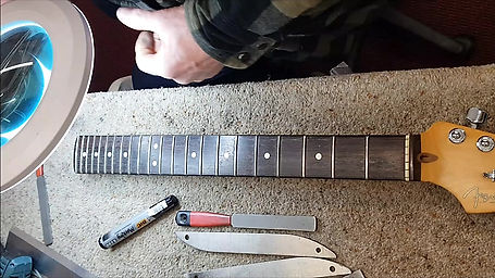 What exactly is a fret dress Level and re-crown?